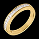present semi paved wedding ring yellow gold channel settin