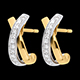 women jewelled white and yellow gold earrings